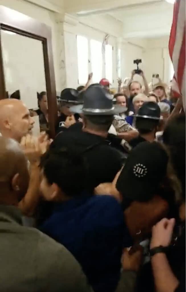 Far-Right Extremists shoved Idaho State Police and shattered the door to the House Gallery on Aug. 24, 2020
